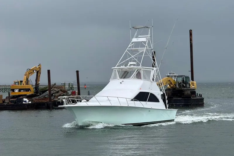Slide: The Image of Interior view of 1996 Ocean Yachts 48 Super Sport, featuring helm and seating area. - 52