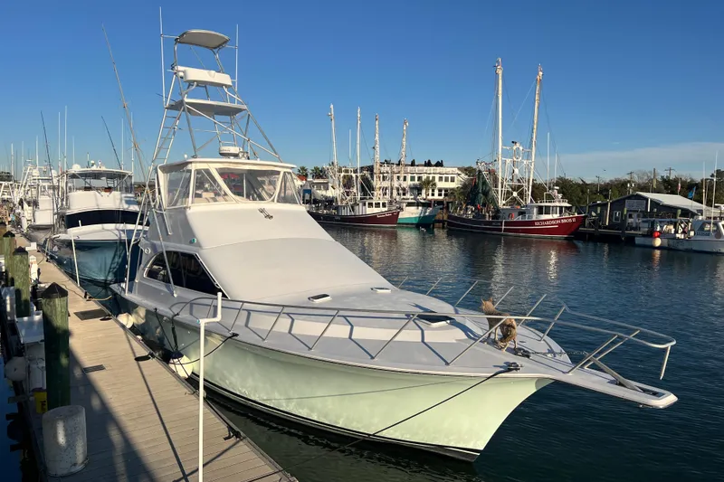 Slide: The Image of Aerial view of 1996 Ocean Yachts 48 Super Sport boat docked in calm water. - 63