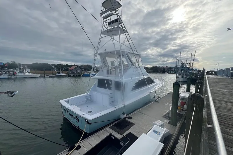 Slide: The Image of 1996 Ocean Yachts 48 Super Sport navigating through choppy waters. - 2