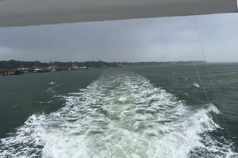 Slide: The Image of Luxurious interior of 1996 Ocean Yachts 48 Super Sport with modern furnishings and ambient lighting. - 5