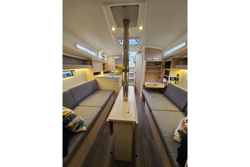 Slide: The Image of Interior of 2023 Beneteau Oceanis 34.1 yacht, featuring modern seating and sleek design. - 10