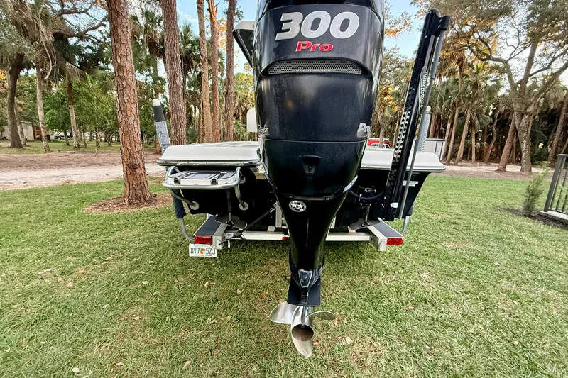 Slide: The Image of 2012 ShearWater 25LTZ boat with 300 Pro engine on grassy area. - 15