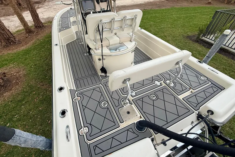Slide: The Image of 2012 ShearWater 25LTZ boat with sleek deck design and comfortable seating. - 18