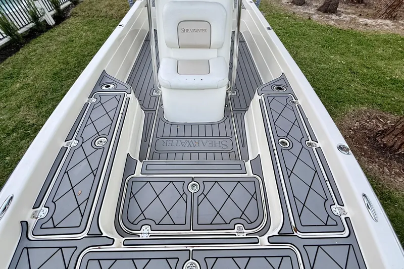 Slide: The Image of 2012 ShearWater 25LTZ boat deck with custom non-slip flooring and seating. - 32