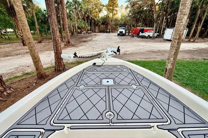 Slide: The Image of Bow view of 2012 ShearWater 25LTZ boat with deck and trolling motor. - 39