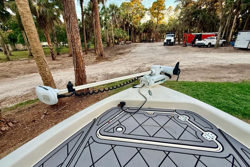 Slide: The Image of 2012 ShearWater 25LTZ boat with trolling motor in a wooded area. - 40