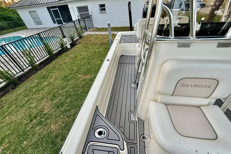 Slide: The Image of 2012 ShearWater 25LTZ boat interior with white seating and sleek design. - 41