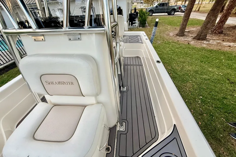Slide: The Image of 2012 ShearWater 25LTZ boat interior with seating and deck view. - 42