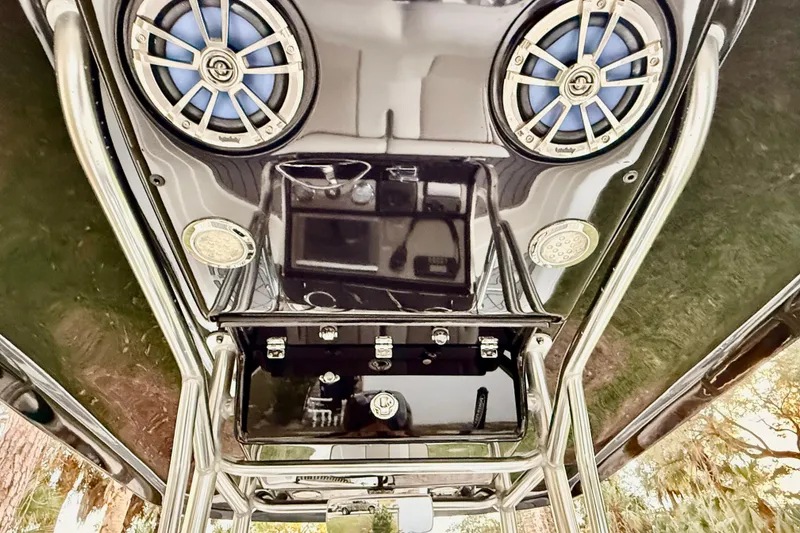 Slide: The Image of 2012 ShearWater 25LTZ boat speakers and console, featuring sleek design and modern audio system. - 55