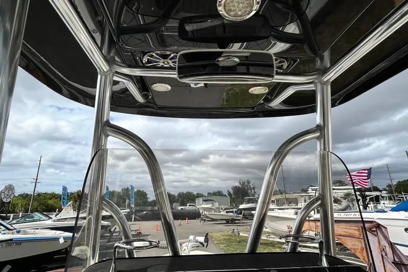 Slide: The Image of Interior view of a 2012 ShearWater 25 LTZ boat with a sleek, modern design. - 67