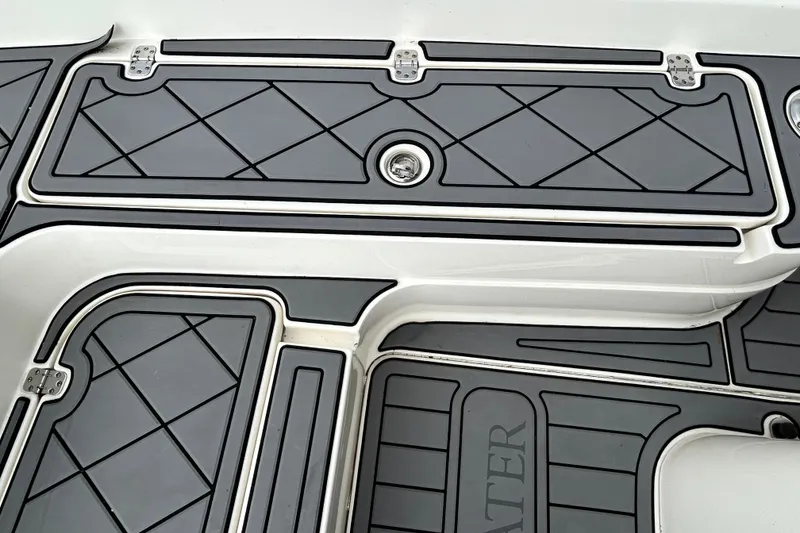 Slide: The Image of Rubberized deck of 2012 ShearWater 25 LTZ boat with diamond pattern design. - 74