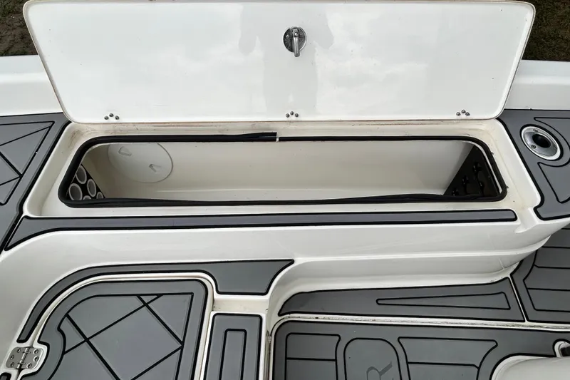 Slide: The Image of Open storage compartment on a 2012 ShearWater 25 LTZ boat deck. - 75