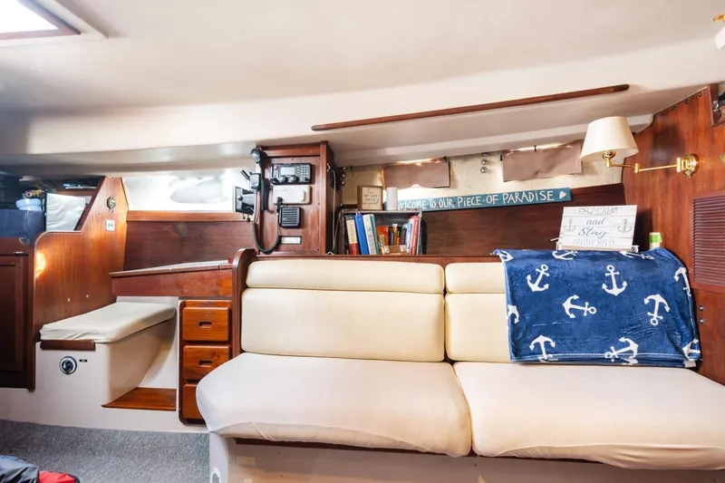 Slide: The Image of Interior of 1987 Morgan 41 Out Island Classic yacht with cozy seating and nautical decor. - 19
