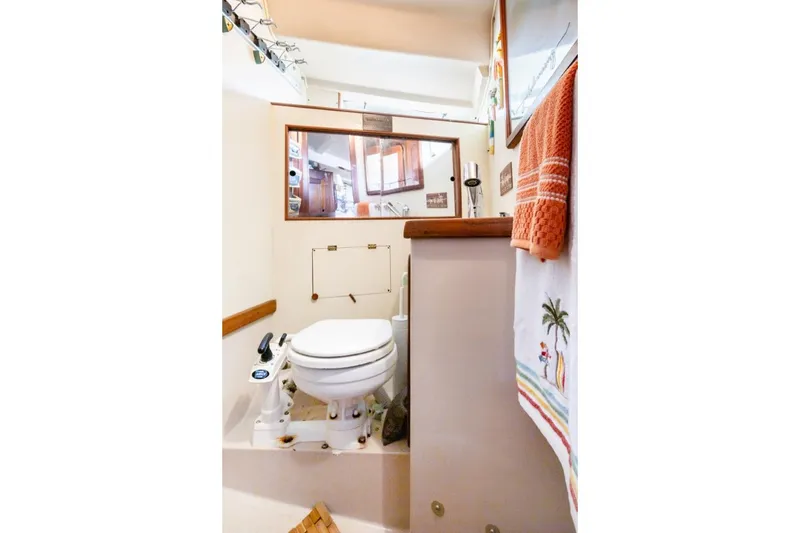 Slide: The Image of 1987 Morgan 41 Out Island Classic yacht bathroom with nautical decor and compact design. - 22