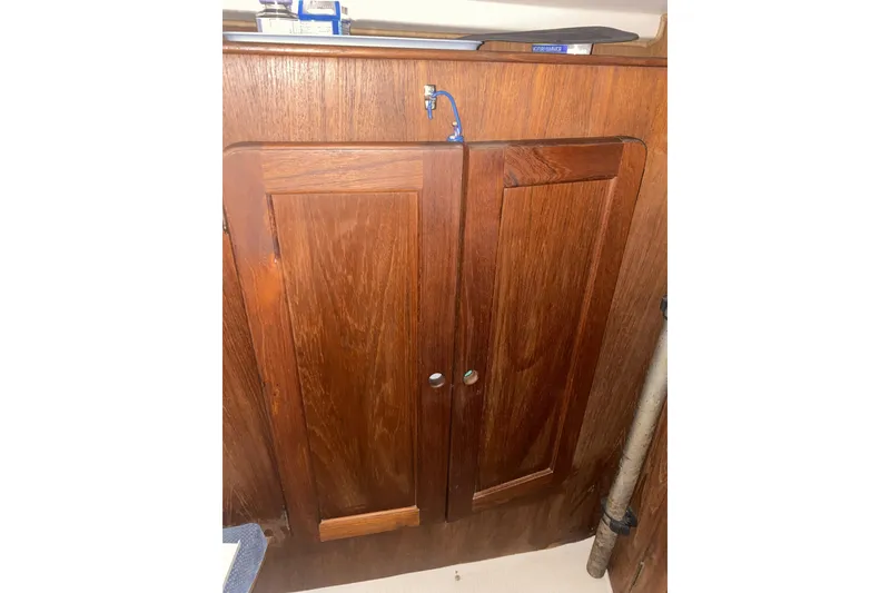 Slide: The Image of Wooden cabinet doors inside 1987 Morgan 41 Out Island Classic yacht interior. - 33