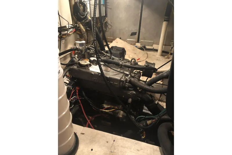 Slide: The Image of Engine room of a 1987 Morgan 41 Out Island Classic sailboat, showing mechanical components. - 37