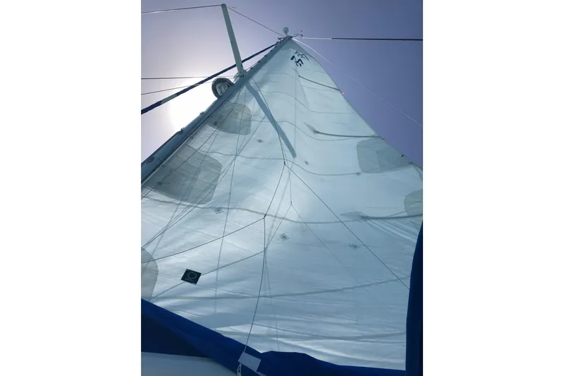 Slide: The Image of Sail of 1987 Morgan 41 Out Island Classic yacht against clear sky. - 38