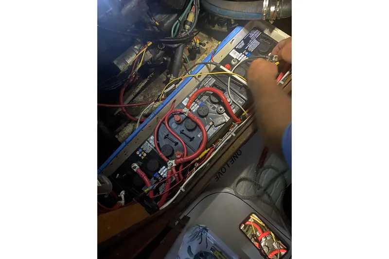 Slide: The Image of 1987 Morgan 41 Out Island Classic battery compartment with wiring and maintenance in progress. - 39