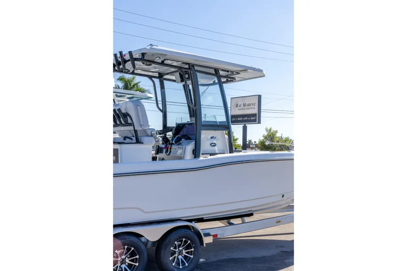 Slide: The Image of 2026 Crevalle 26 HCO boat on trailer at Bay Marine dealership. - 11