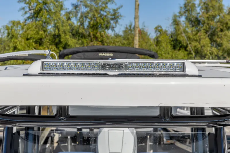 Slide: The Image of 2026 Crevalle 26 HCO boat with LED light bar, outdoor setting. - 20