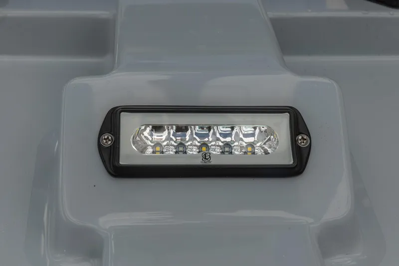 Slide: The Image of LED light fixture on 2026 Crevalle 26 HCO boat, mounted on a gray surface. - 21