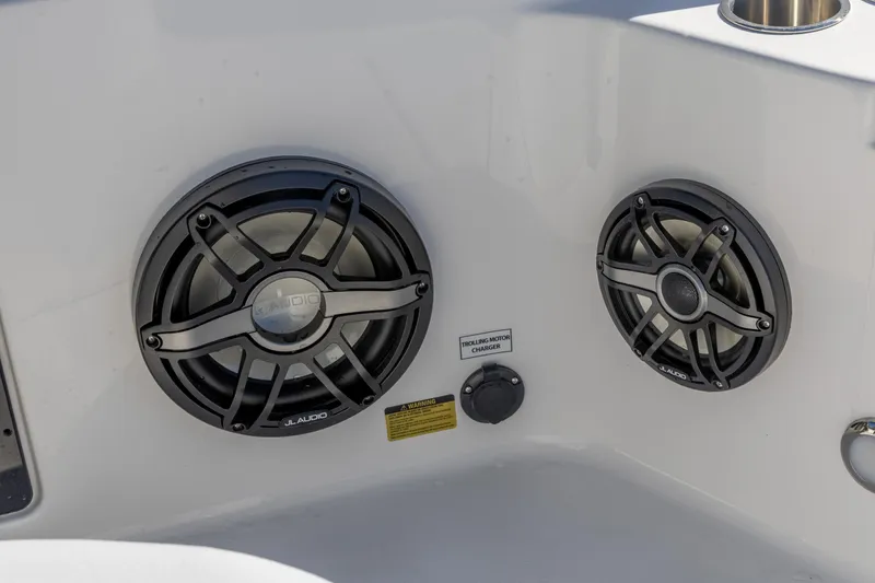 Slide: The Image of JL Audio speakers on 2026 Crevalle 26 HCO boat, featuring trolling motor charger. - 22