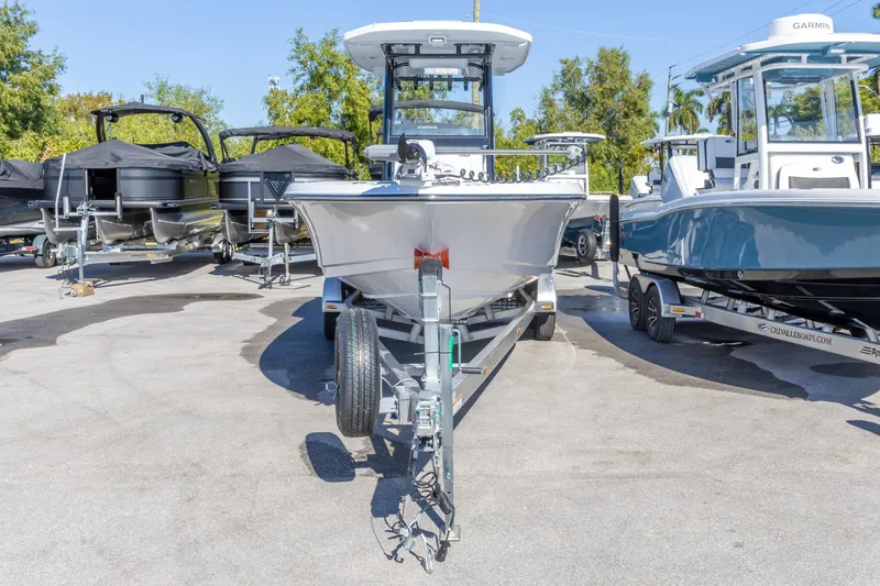 Slide: The Image of 2026 Crevalle 26 HCO boat on trailer, surrounded by other boats in a dealership. - 29
