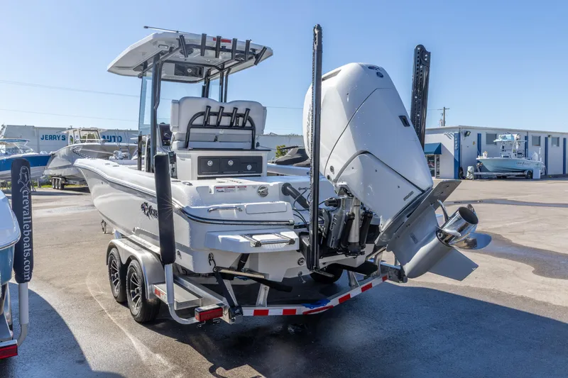 Slide: The Image of 2026 Crevalle 26 HCO boat on trailer, featuring powerful outboard motor. - 31