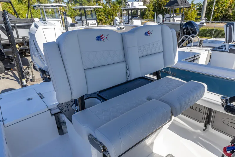 Slide: The Image of 2026 Crevalle 26 HCO boat with luxurious white seating and modern design. - 4