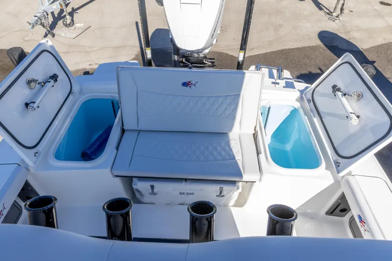 Slide: The Image of 2026 Crevalle 26 HCO boat interior with seating and storage compartments. - 6