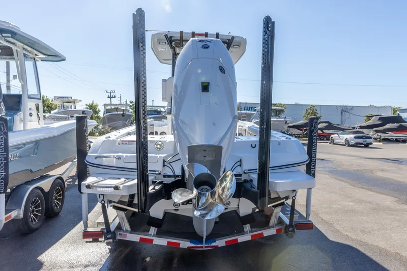Slide: The Image of 2026 Crevalle 26 HCO boat on trailer, rear view with outboard motor. - 7
