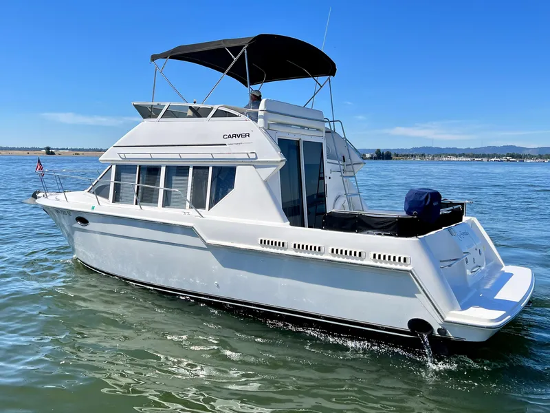 Slide: The Image of 1997 Carver 320 Voyager on calm waters. - 2