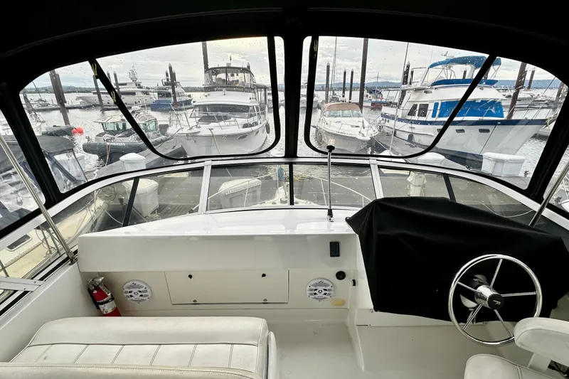 Slide: The Image of Interior view of a 1997 Carver 320 Voyager yacht at a marina. - 23