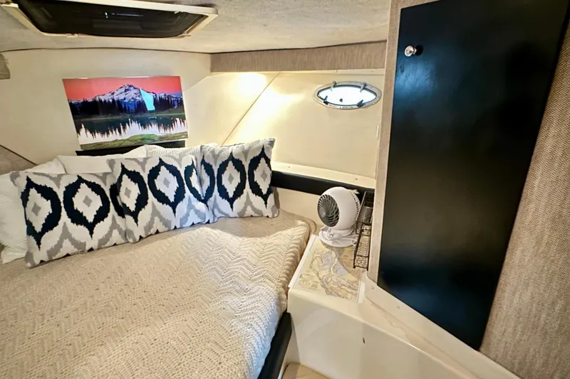 Slide: The Image of Cozy interior of 1997 Carver 320 Voyager with decorative pillows and wall art. - 24