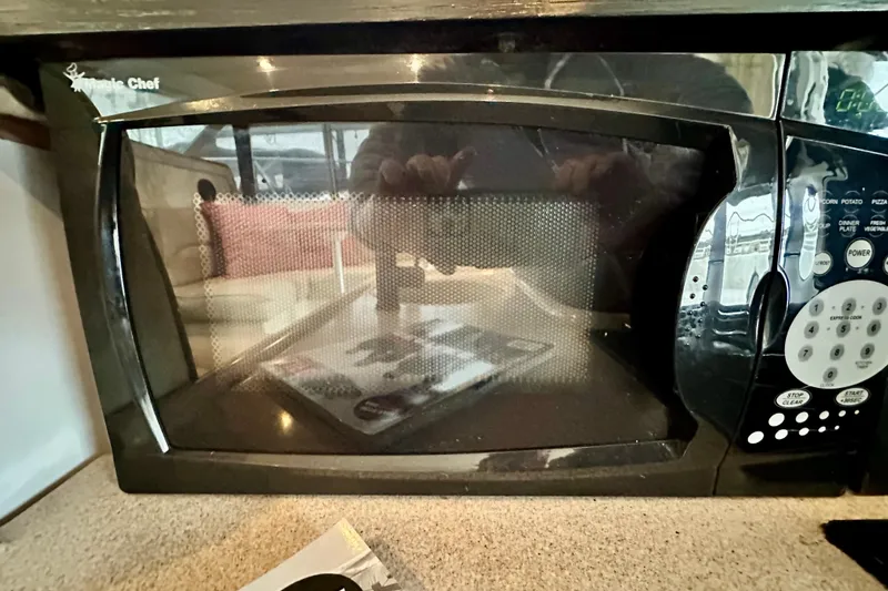 Slide: The Image of Magic Chef microwave inside a 1997 Carver 320 Voyager boat kitchen. - 29