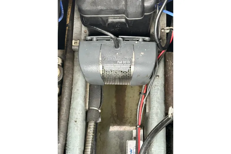 Slide: The Image of 1997 Carver 320 Voyager engine compartment with Pall 9510 heater and wiring. - 33