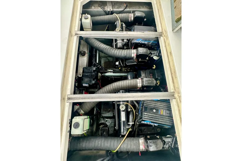 Slide: The Image of Engine compartment of a 1997 Carver 320 Voyager with MerCruiser engines. - 35