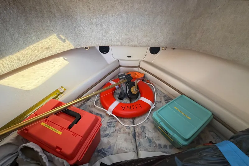 Slide: The Image of 2001 Grady-White Sailfish 282 cabin with safety equipment and storage boxes. - 11