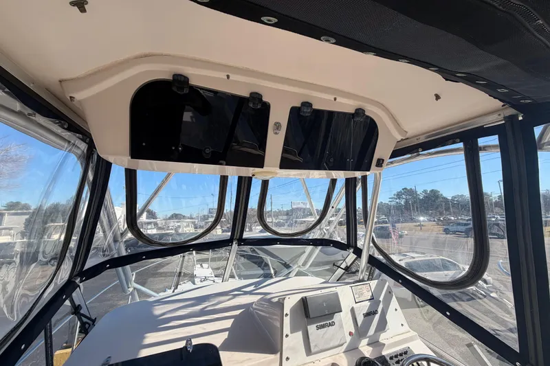 Slide: The Image of Interior view of 2001 Grady-White Sailfish 282 boat cockpit with navigation equipment. - 8