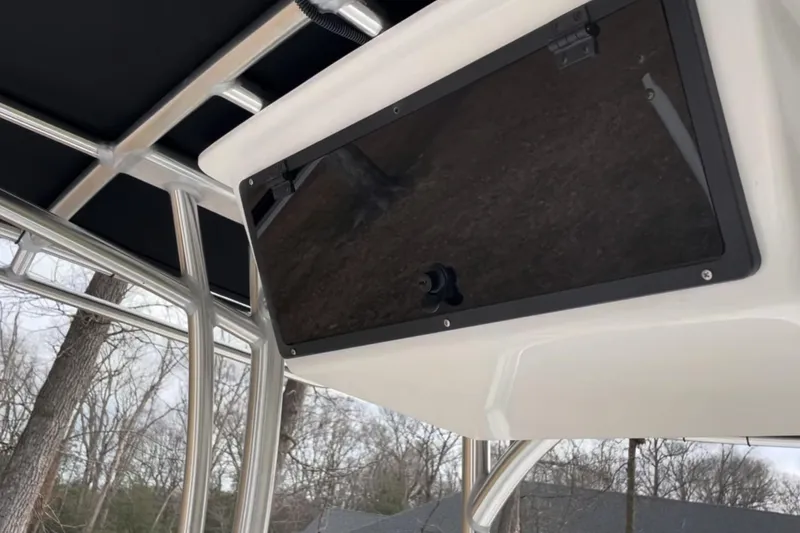 Slide: The Image of 2024 C-Hawk 23 Center Console boat with sleek black console panel. - 8