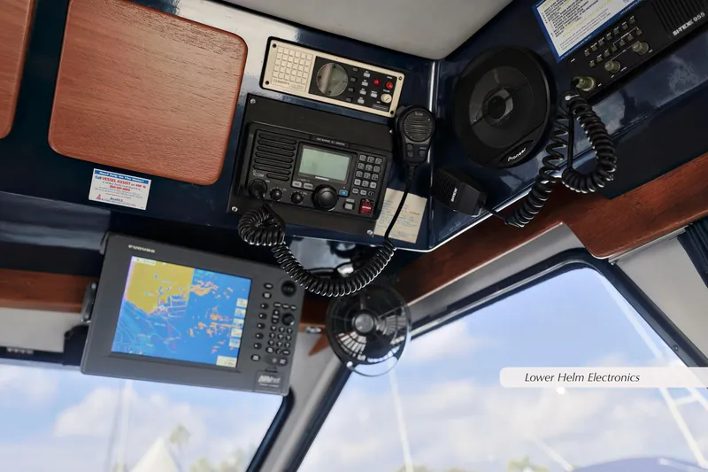 Slide: The Image of Lower helm electronics of 1988 Mediterranean 38 Convertible boat with navigation and communication equipment. - 14
