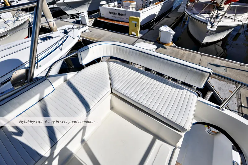 Slide: The Image of 1988 Mediterranean 38 Convertible yacht with pristine flybridge upholstery at marina. - 5