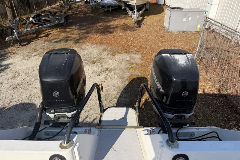 Slide: The Image of 2002 Pro Sports 2860 CC ProKat boat with dual Mercury outboard engines. - 2