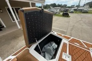 Slide: The Image of 2017 Tigé RZX2 boat storage compartment open, showcasing interior space. - 26