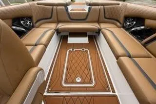 Slide: The Image of 2017 Tigé RZX2 boat interior with luxurious tan seating and stylish design. - 30