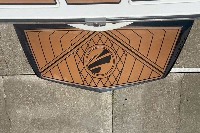 Slide: The Image of 2017 Tigé RZX2 boat swim platform with geometric design and logo. - 32