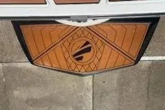 Slide: The Image of 2017 Tigé RZX2 boat with custom geometric design on swim platform. - 5