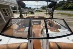 Slide: The Image of 2017 Tigé RZX2 boat interior with tan seating and sleek design. - 16