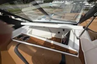 Slide: The Image of 2017 Tigé RZX2 boat interior with cup holders and sleek design. - 20