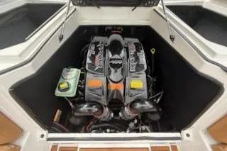 Slide: The Image of 2017 Tigé RZX2 boat engine compartment with powerful inboard motor. - 28